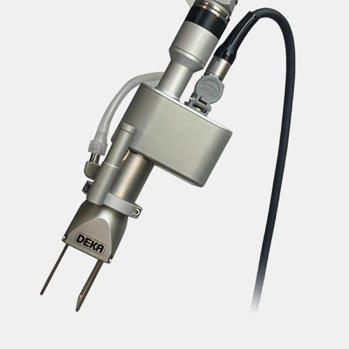 Dental intraoral camera with attached cord and metal housing on white background.